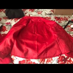 Red, zippered front,  mandarin colored Jacket.